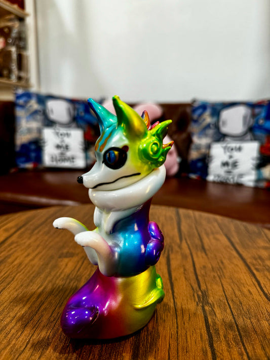 Urukoma - Metallic Rainbow by YASU, a 13cm colorful animal figurine, limited to 25 pieces, displayed on a wooden surface.