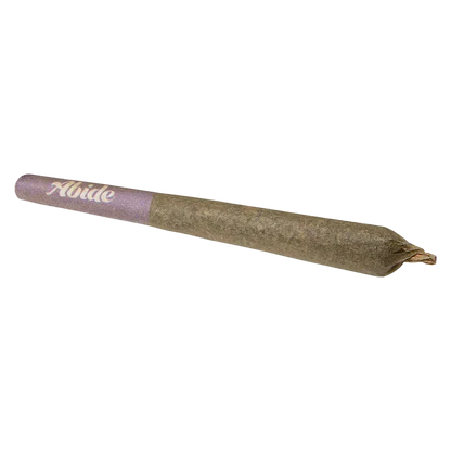 Angled close-up of a pre-rolled joint with a purple filter tip labeled "CBG Infused Mango PR 3 x 0.5 g" on a white background