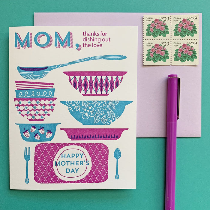 By Paper Parasol Press. Send your mom some pyrex cheer for Mother's Day! Dishing Out the Love Card details: A2 Size. 2 color letterpress printed card. Blank interior. Comes with a light purple envelope. Printed in the USA.