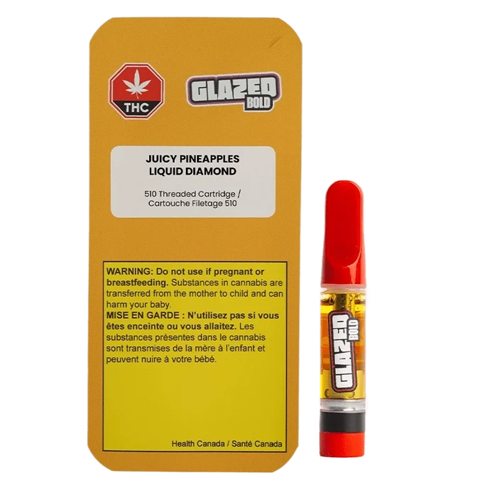 Bright studio front view of the Juicy Pineapples Liquid Diamond Vape Cartridge showing its yellow-labeled box with warning panel beside a red-tipped 1 g cartridge.