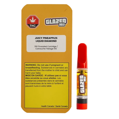 Bright studio front view of the Juicy Pineapples Liquid Diamond Vape Cartridge showing its yellow-labeled box with warning panel beside a red-tipped 1 g cartridge.