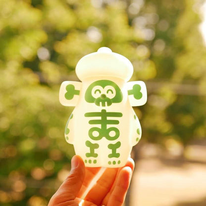 Hand holding OHIGE no PON - Bone Edition, a Japanese Sofubi toy, H135mm×W105mm×D80mm.
