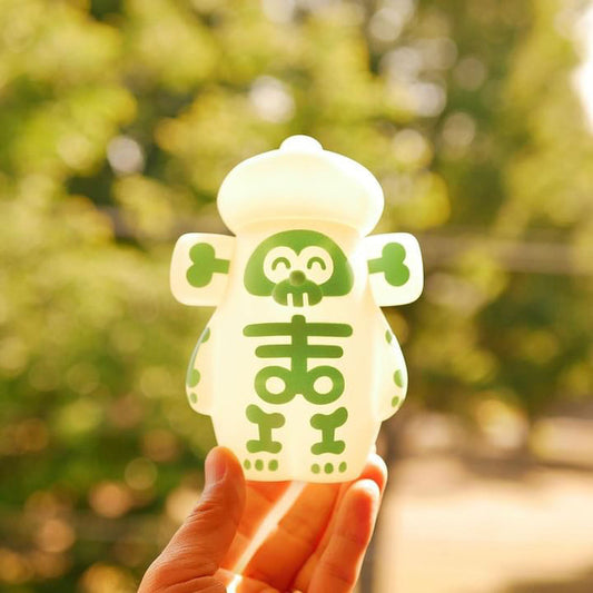 Hand holding OHIGE no PON - Bone Edition, a Japanese Sofubi toy, H135mm×W105mm×D80mm.