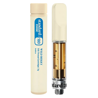 Close-up front view of the Wild Berry Vape Cartridge showing a clear glass cartridge with gold interior components beside its cream-colored 1 g tube.
