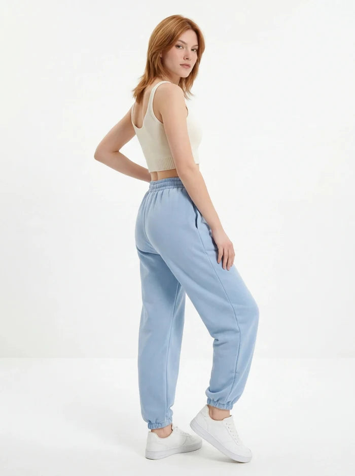 Damskie spodnie dresowe oversize UNLEASH WINGS PASTEL BLUE WINGS UNLEASH