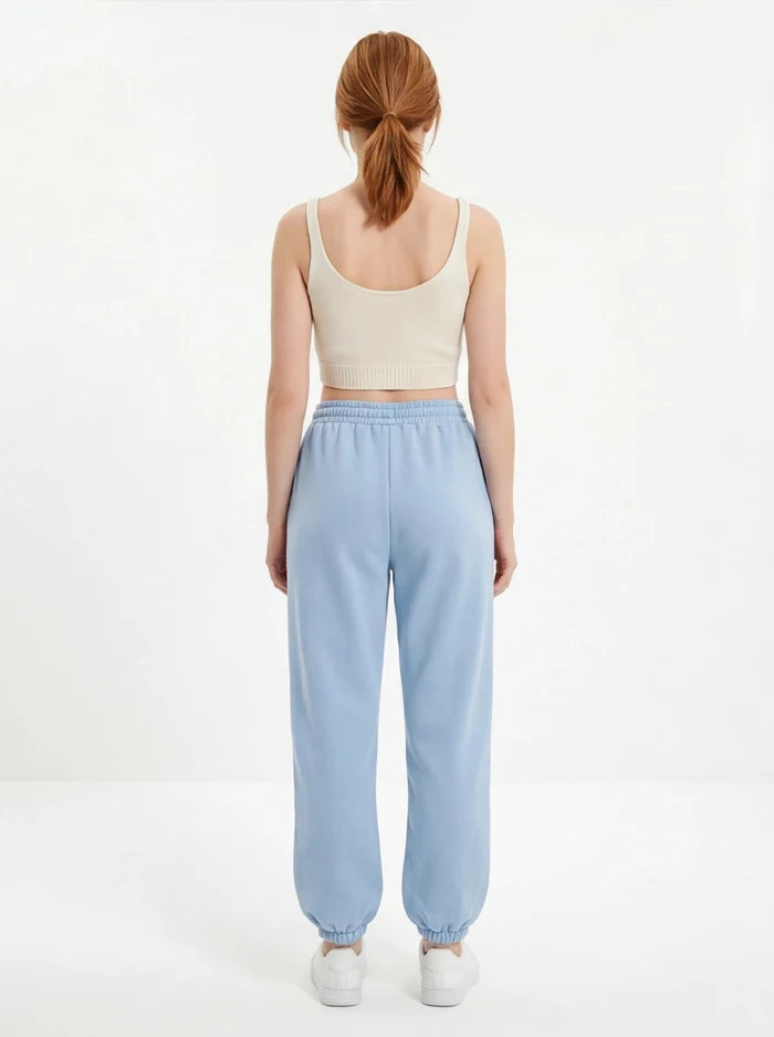 Damskie spodnie dresowe oversize UNLEASH WINGS PASTEL BLUE WINGS UNLEASH