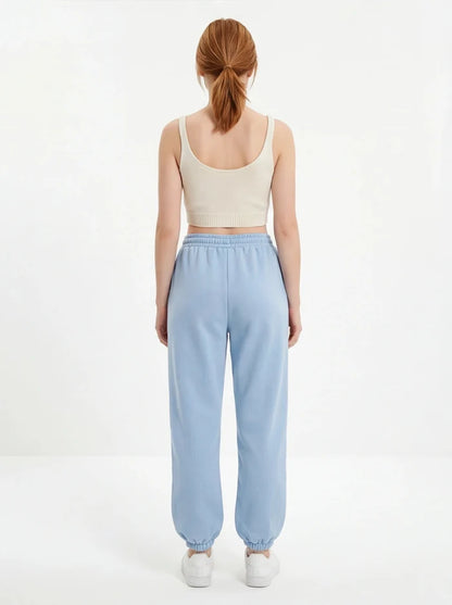 Damskie spodnie dresowe oversize UNLEASH WINGS PASTEL BLUE WINGS UNLEASH